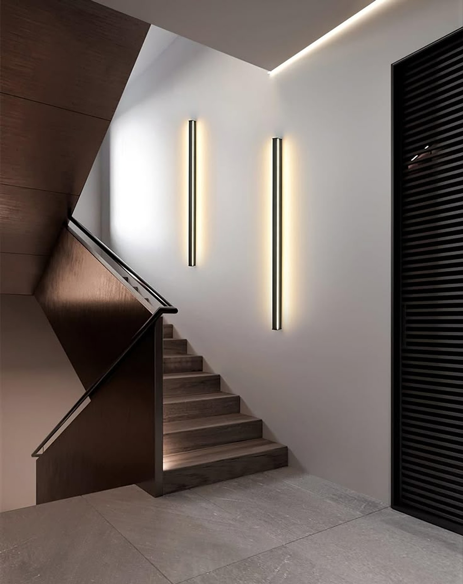 Minimalist linear LED wall lights on a staircase